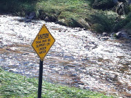 Caution, Trail May be Slippery or Under Water