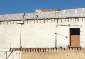 Arched windows suggest building is, or next to the one pictured as the Deline Manufacturing Company